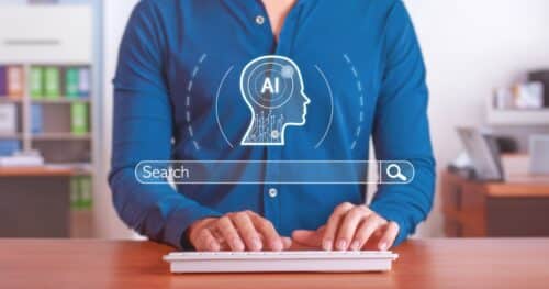 A person typing on a keyboard with an "AI" graphic overlay, symbolizing artificial intelligence in a search context.